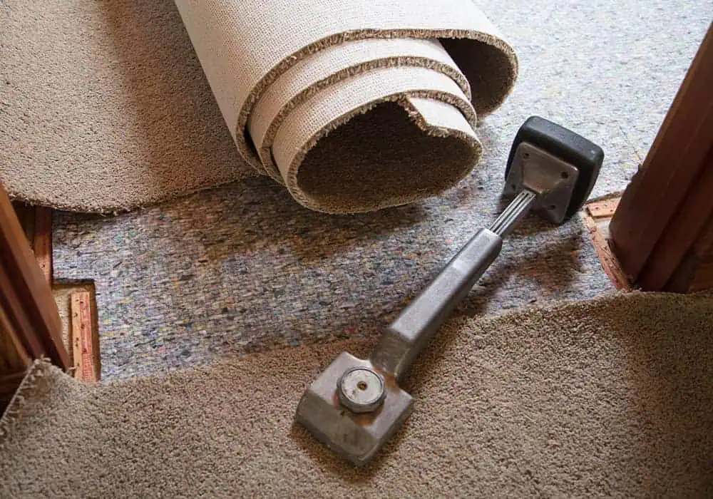 Underlay being installed underneath a new carpet as it offers multiple benefits