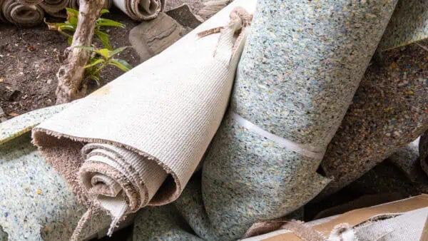 Carpet and underlay thrown away as they have come to the end of their lifespan