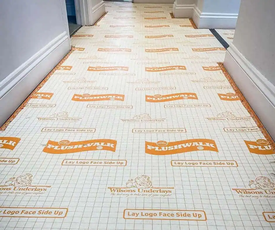 Plushwalk underlay laid in hallway creating a flat subfloor