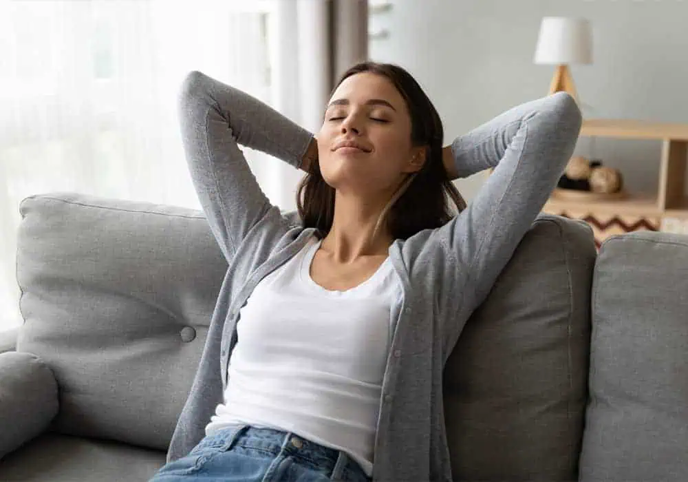 Woman relaxing on chair in a peaceful home