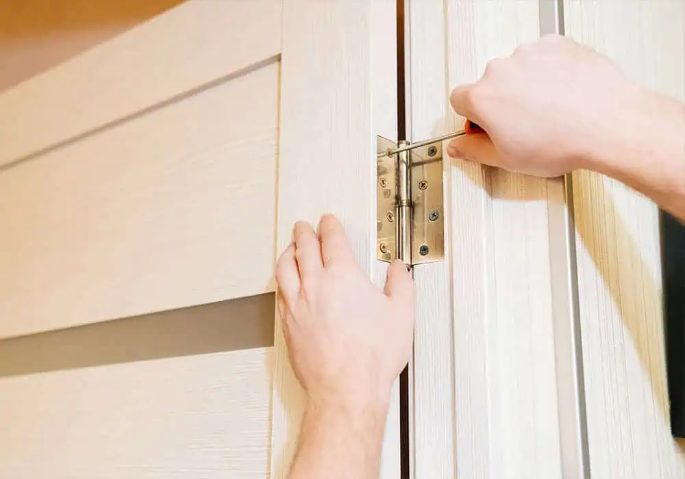 Joiner rehanging an internal door