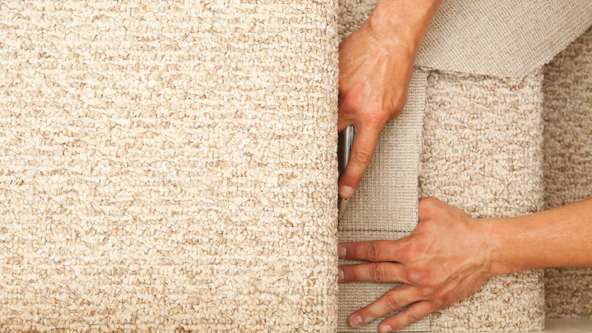 UK carpet fitter installing a stair carpet