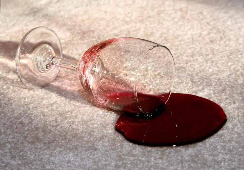 Wine spilt on carpet with stain protection treatment