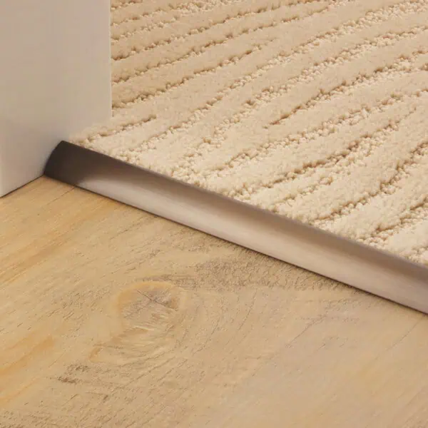 Stairrods Single 9 Premier Antique Bronze Threshold Strip edging carpet to wood flooring in a doorway