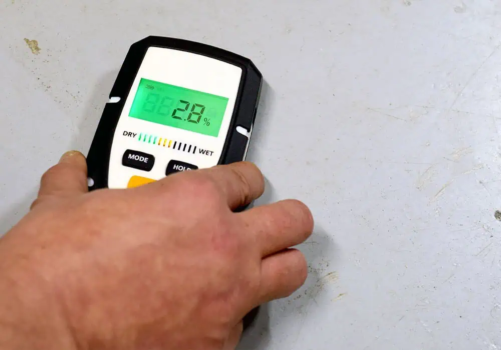 Checking a subfloor using a moisture meter