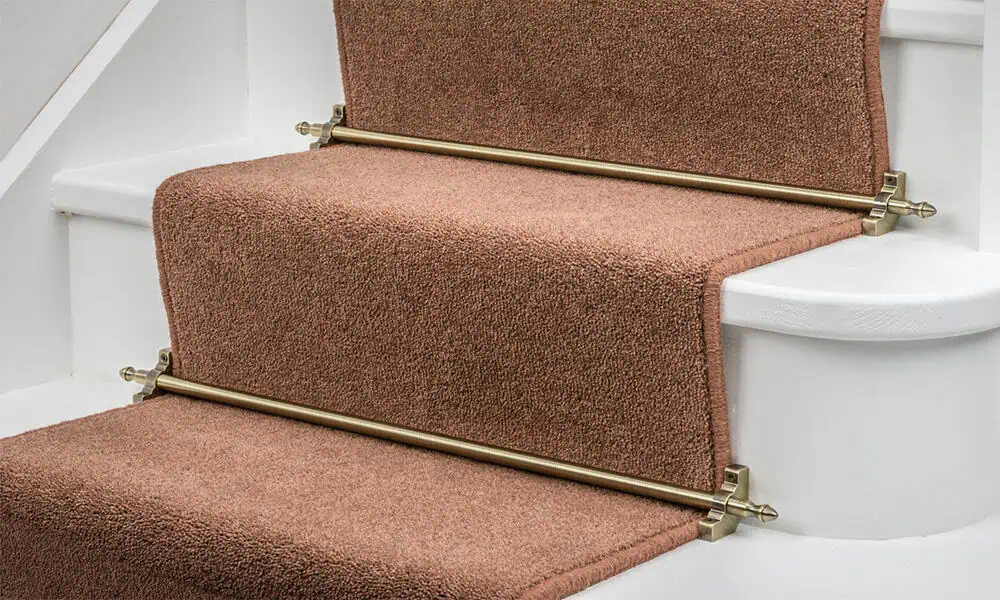 Decorative stair rods installed with a carpet runner