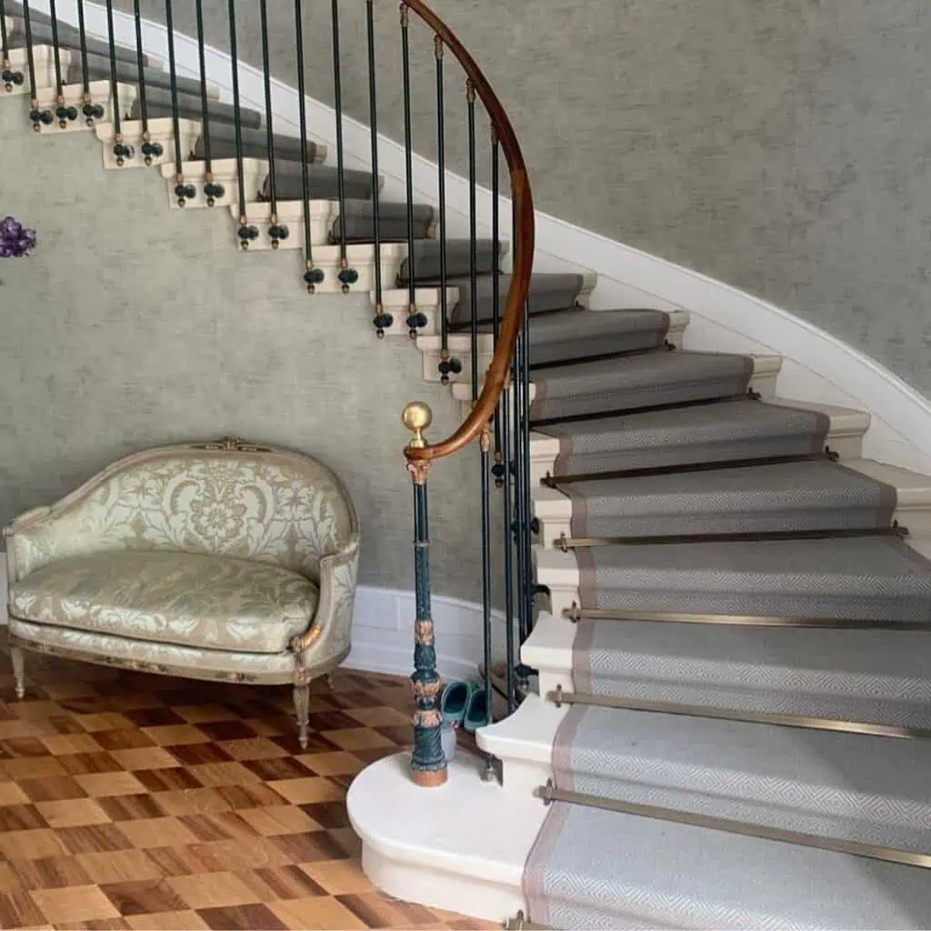 Brass stair rods on a grand stair case