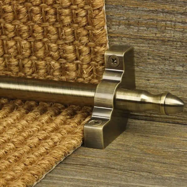 Homepride Stair Carpet Runner Rod in Antique Brass with a sisal carpet on wooden stairs