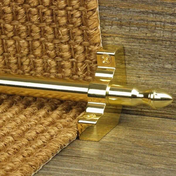 Homepride Stair Carpet Runner Rod in Shiny Brass with a sisal carpet on wooden stairs