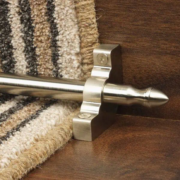 Homepride Stair Carpet Runner Rod in Satin Nickel with a striped carpet on wooden stairs